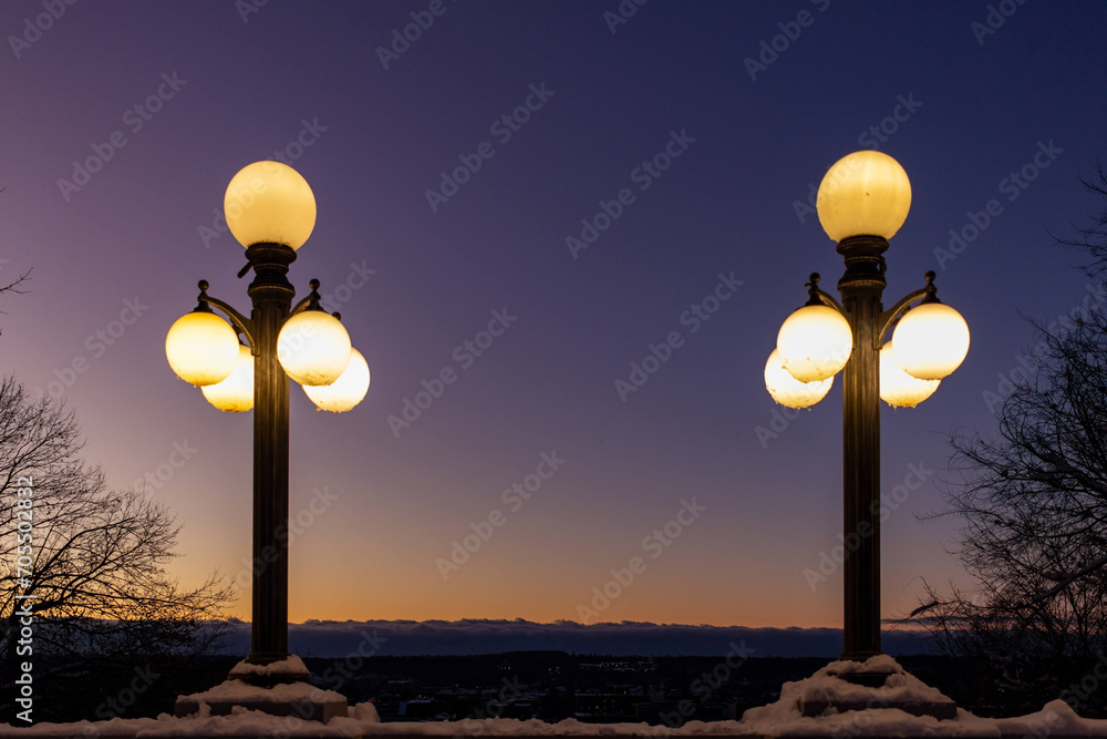 Pair of lamps glowing after sunset