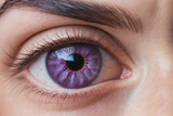 A close-up beautiful eye of a female person, natural growing floral pink and purple flowers in the eye iris