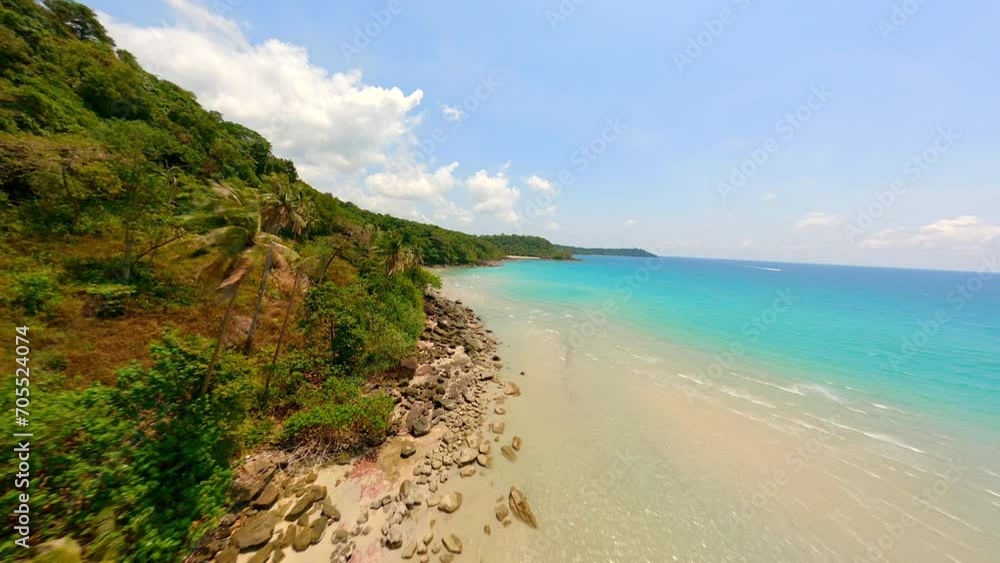 Cinematic FPV drone flight over tropical coast with white sandy beach, palm trees, and turquoise sea on paradise island in Thailand. Cinematic FPV drone flight over tropical coast with white sandy beach, palm trees, and turquoise sea on paradise island in Thailand.