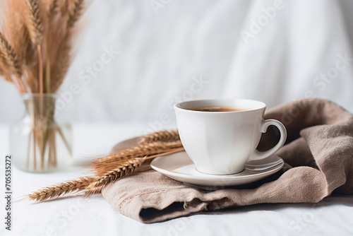 A white coffee cup on a rustic wooden table exuding the rich aroma of fresh coffee.