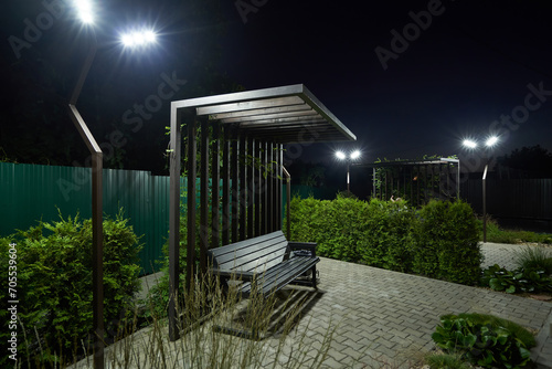 Garden bench with modern lighting in the evening