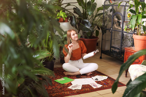 Young female creating her Feng Shui wish map. Dreams and wishes photo