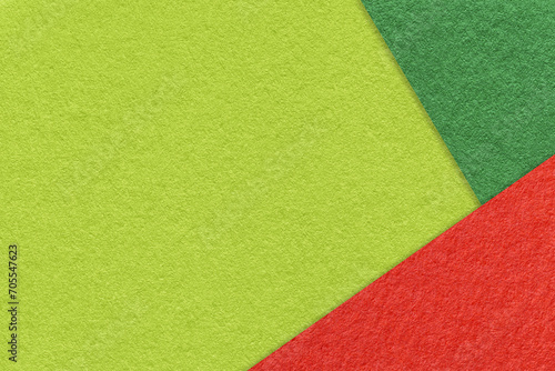 Texture of craft green color paper background with olive and red border. Vintage abstract cardboard.