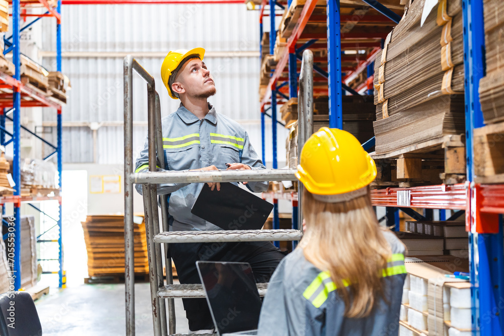 Professional worker team in safety uniform, supervisor inspector in packaging stock order at cardboard factory warehouse, piles of stacking paper manufacture, recycling industrial production Professional worker team in safety uniform, supervisor inspector in packaging stock order at cardboard factory warehouse, piles of stacking paper manufacture, recycling industrial production