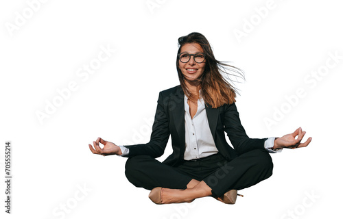Relaxed businesswoman in a suit practices meditation in front of a modern office building, blending mindfulness with corporate life