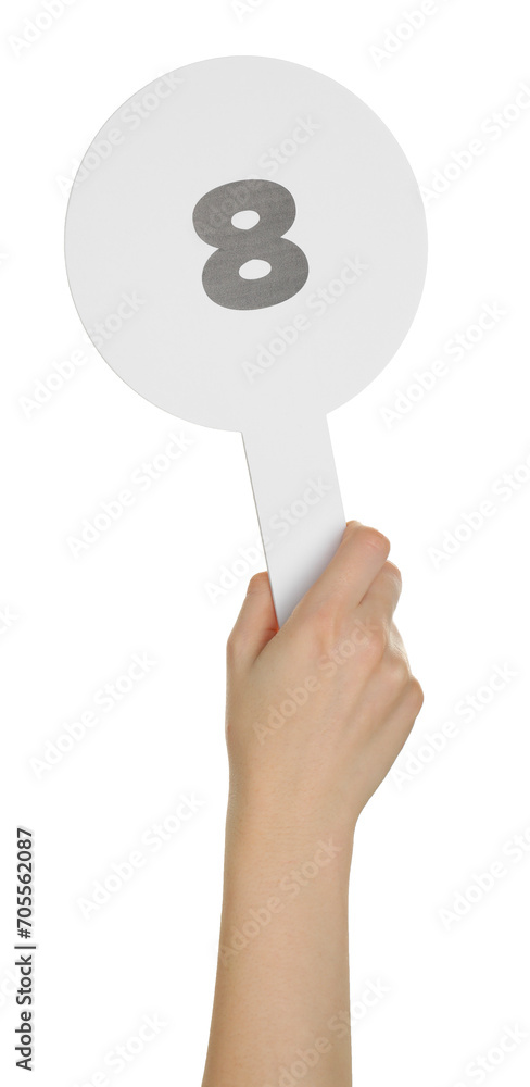 Woman holding auction paddle with number 8 on white background, closeup Woman holding auction paddle with number 8 on white background, closeup