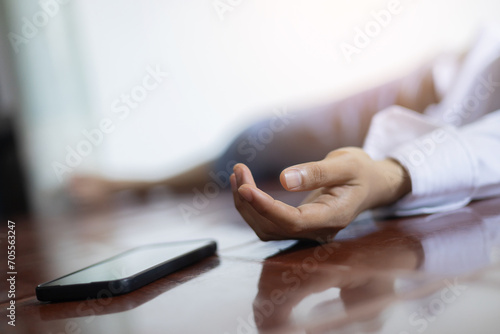 фотографія close up adult man hand lying on home's floor in living room after got fainted s