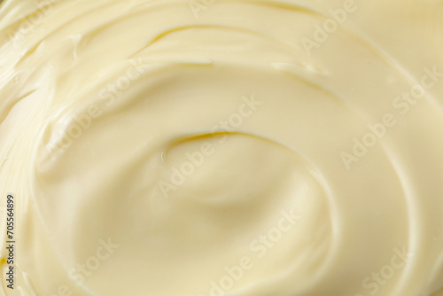 Fresh mayonnaise sauce as background, closeup. Top view
