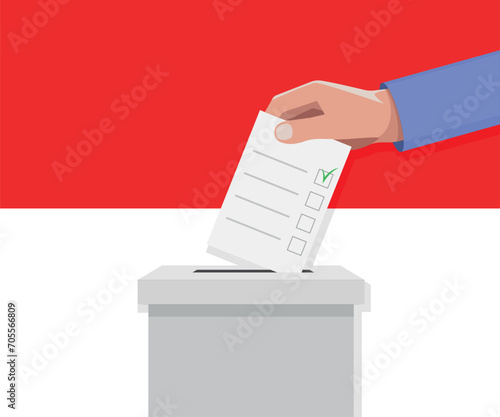 Indonesia election concept. Hand puts vote bulletin