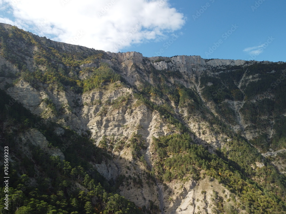 Aerial panoramic view of forest on rocky mountain slope - Ai Petri, Yalta, Crimea. Abstract aerial nature forest and mountains. Weather and Climate Change. Vacation, travel and holiday concept