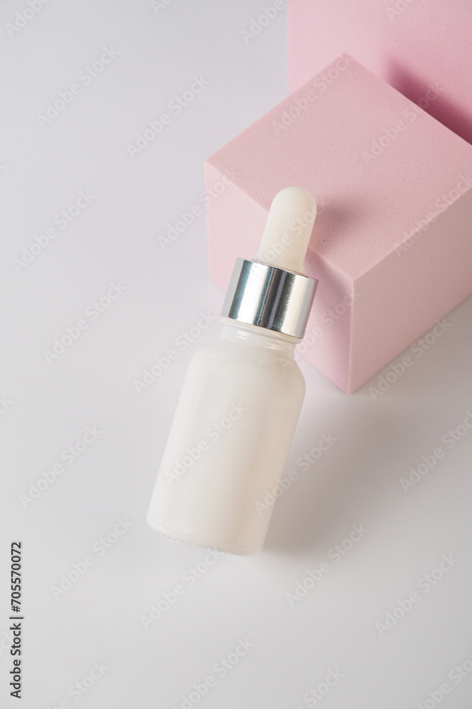 Plastic white tube for cream or lotion. Skin care or sunscreen cosmetic with stylish props on white background Plastic white tube for cream or lotion. Skin care or sunscreen cosmetic with stylish props on white background