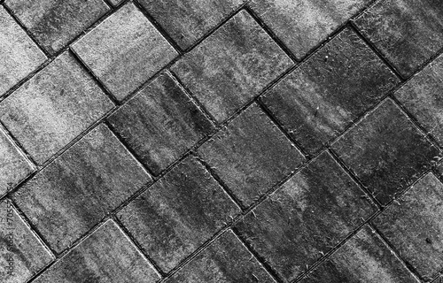 Gray concrete cobble road background  paving slabs pattern