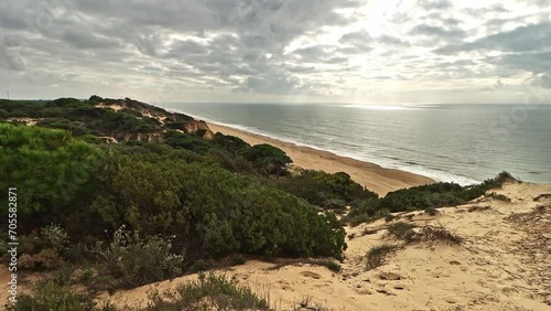 Cloudy day on the beautiful Arenosillo beach, Mazagon, Huelva, Spain. photo