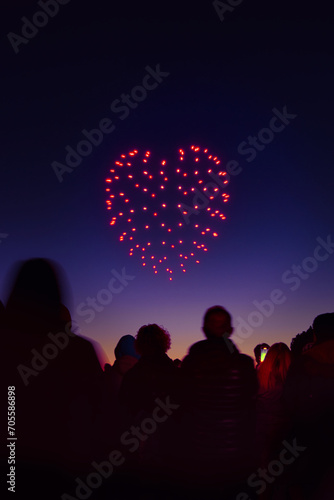 Heart drawn with drone lights in the night sky of Arroyomolinos, Madrid (Spain).