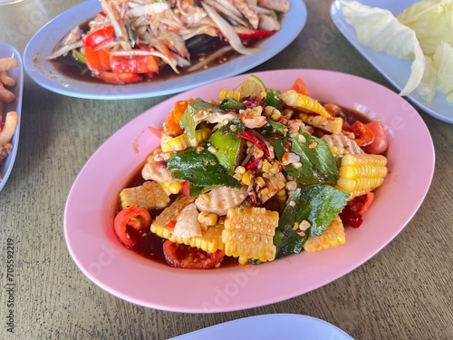 Papaya salad with fermented fish, salted crab, pork loaf, tomato, snake beans, palm sugar, lime juice, fish sauce and chilli , street Thai food.