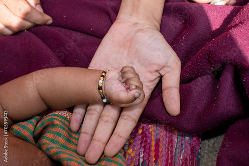 Concept of love and family. hands of mother and baby closeup © Kiran