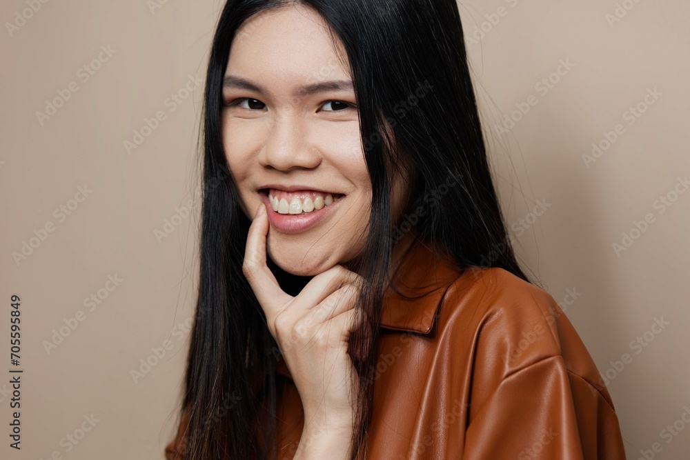 Fototapeta premium Woman femininity cosmetic fashion beautiful asian portrait glamour model beauty hair beige