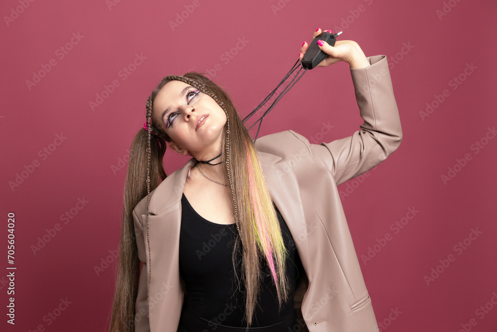 Beautiful young woman with lots of computer cables over her head, peeking behind a computer mouse Beautiful young woman with lots of computer cables over her head, peeking behind a computer mouse
