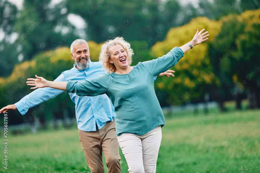 woman man couple happy together mature active balance walk balancing challenge step exercise recreation acrobat game bonding love outdoor walking leisure park fun exercise middle mid aged active woman man couple happy together mature active balance walk balancing challenge step exercise recreation acrobat game bonding love outdoor walking leisure park fun exercise middle mid aged active