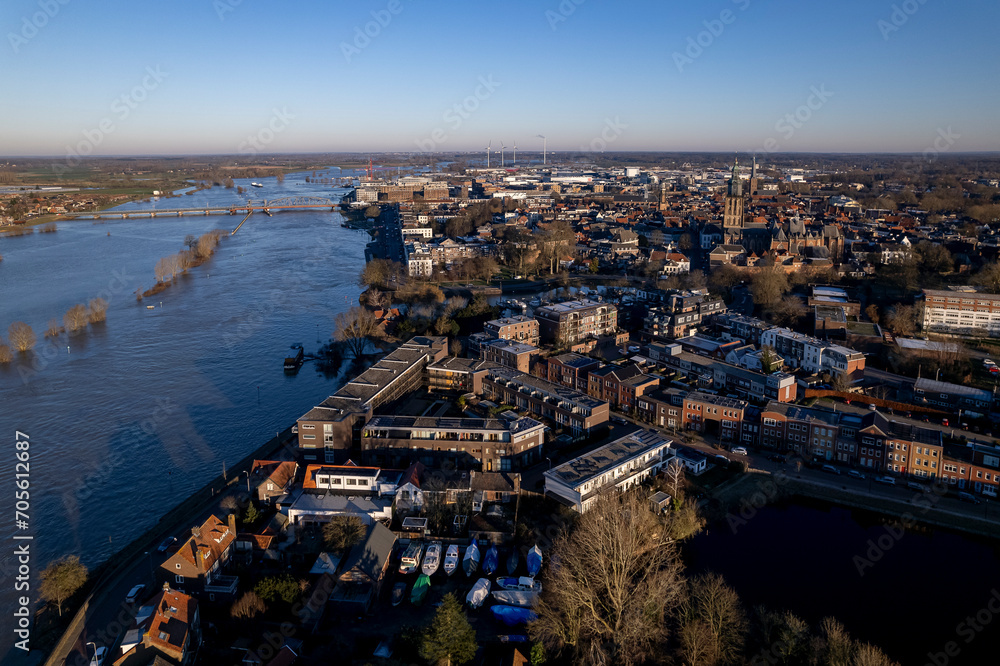 Fototapeta premium Cityscape aerial during extreme high water level of river IJssel in Zutphen, The Netherlands. Weather and climate concept.