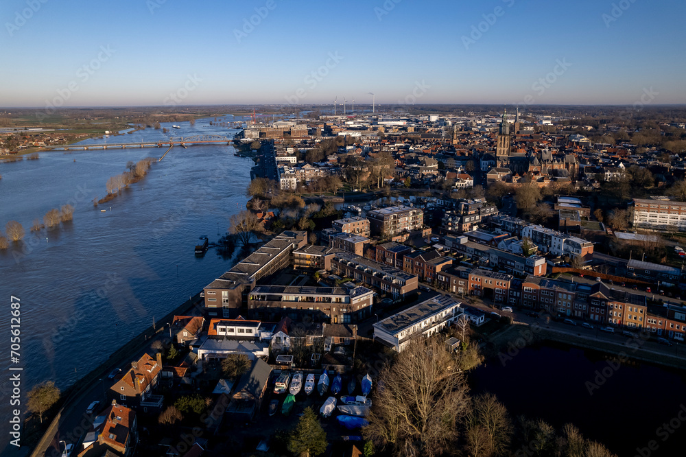 Cityscape aerial during extreme high water level of river IJssel in Zutphen, The Netherlands. Weather and climate concept.