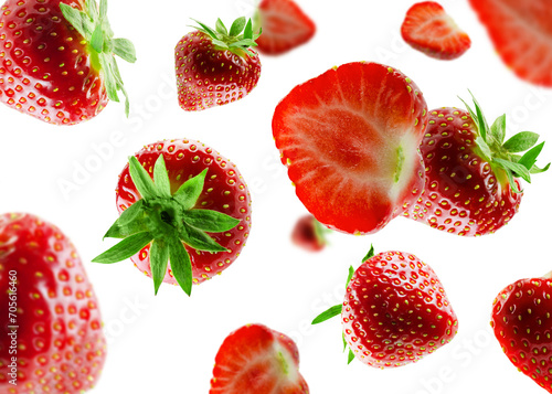 Billede på lærred Excellently retouched whole and halved strawberries fly and levitate in space