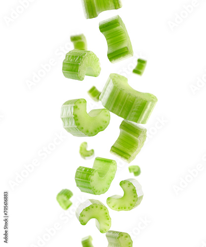 Pieces of celery fall in space. Isolated on white