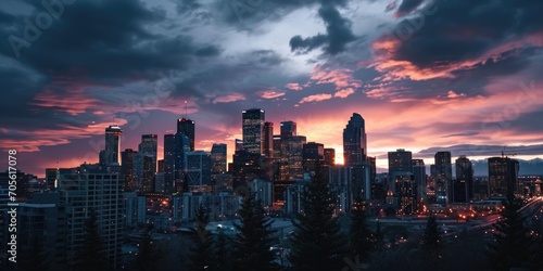 A view of a city at dusk with a cloudy sky. Perfect for urban landscapes and cityscape photography. © Fotograf