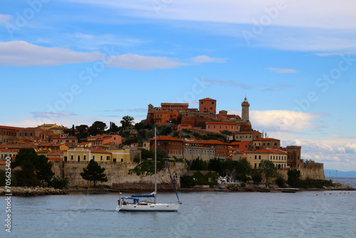 View of the small town of Portoferraio with its lighthouse Faro di Forte Stella on the island of Elba, Livorno, Italy