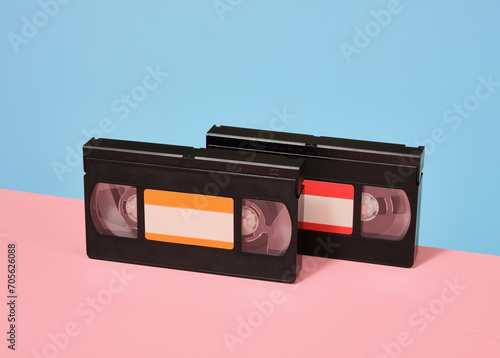 Two retro videotapes on the table. Movie watching, nostalgia, vintage composition.