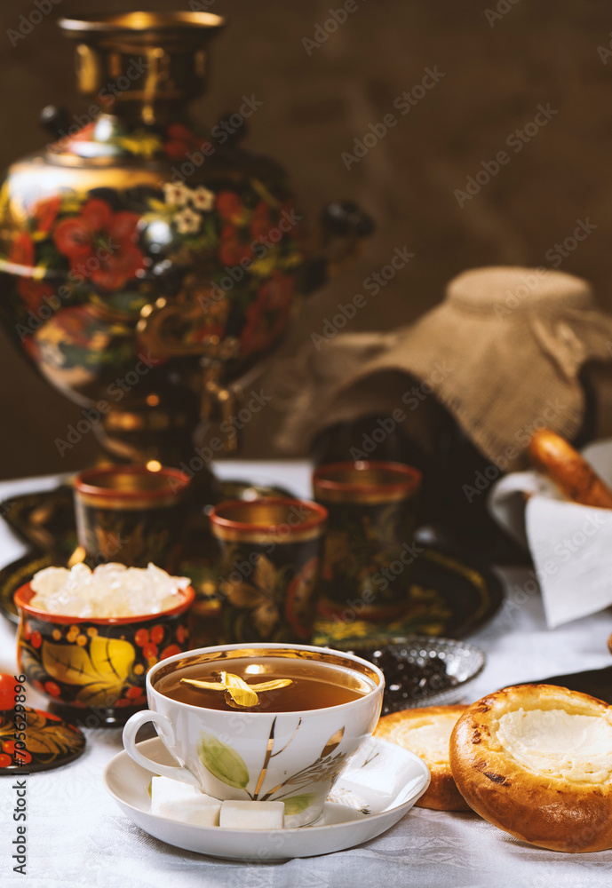 Cup of tea with lemon and honey on a wooden background. Ukrainian  or Russian style
