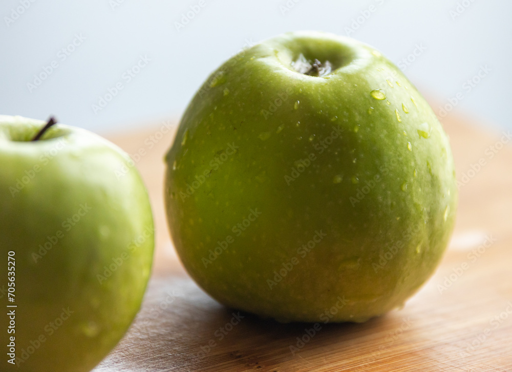 Fresh Organic Green Apple with Water Drops on Wooden Board - Crisp and Juicy Delight Fresh Organic Green Apple with Water Drops on Wooden Board - Crisp and Juicy Delight