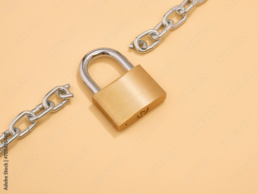 A lock to secure the property. The chain is broken in two parts. A lock to secure the property. The chain is broken in two parts.
