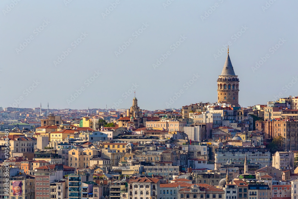 Cityscape with Galata Tower and Beyoglu, or Pera district in Istanbul in a beautiful summer day. Tourism or architecture history concept. Istanbul, Turkey