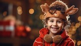 On an orange background, a happy child wearing a reindeer headpiece and a Christmas jumper, Generative AI.