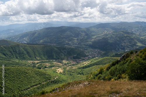 Landscape with mountains and villages in valley during sunny day with dramatic clouds, mountain Vlasic near Travnik