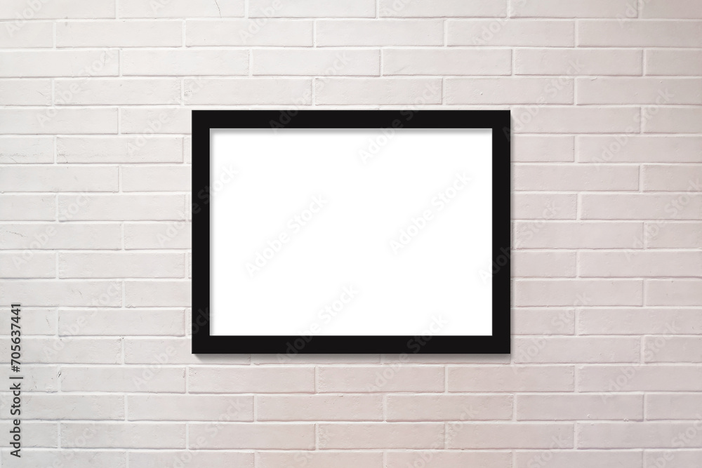 Brick wall painted in white and a horizontal picture frame Brick wall painted in white and a horizontal picture frame