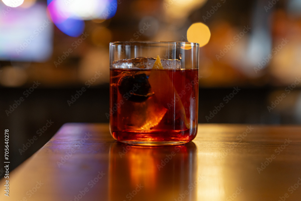 Close up of classic negroni cocktail. Alcoholic drink with gin, vermouth, and campari Close up of classic negroni cocktail. Alcoholic drink with gin, vermouth, and campari