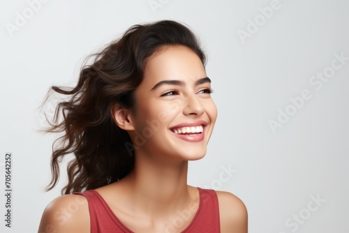Studio Photo of Cheerful Woman with Glowing Smile. Photo Concept for Cosmetic or Dental Ads.