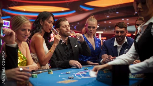Happy Glamorous Couple Spending a Night Out in Stylish Modern Casino. Group of Diverse People Playing Blackjack and Gambling and Placing Bets. Private Social Club for Pleasant Leisure Time