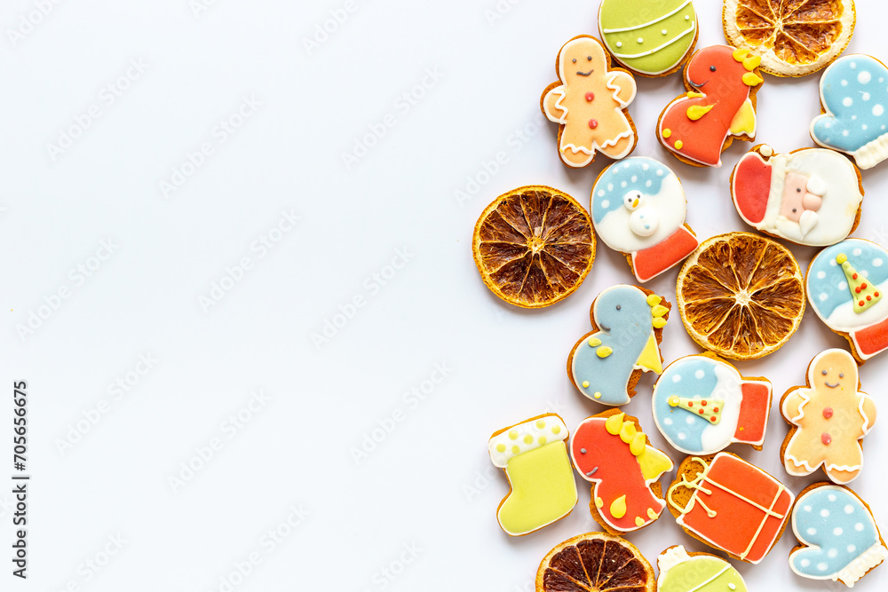 Christmas cookies in the shape of a dragons and New Years decoration with candied oranges