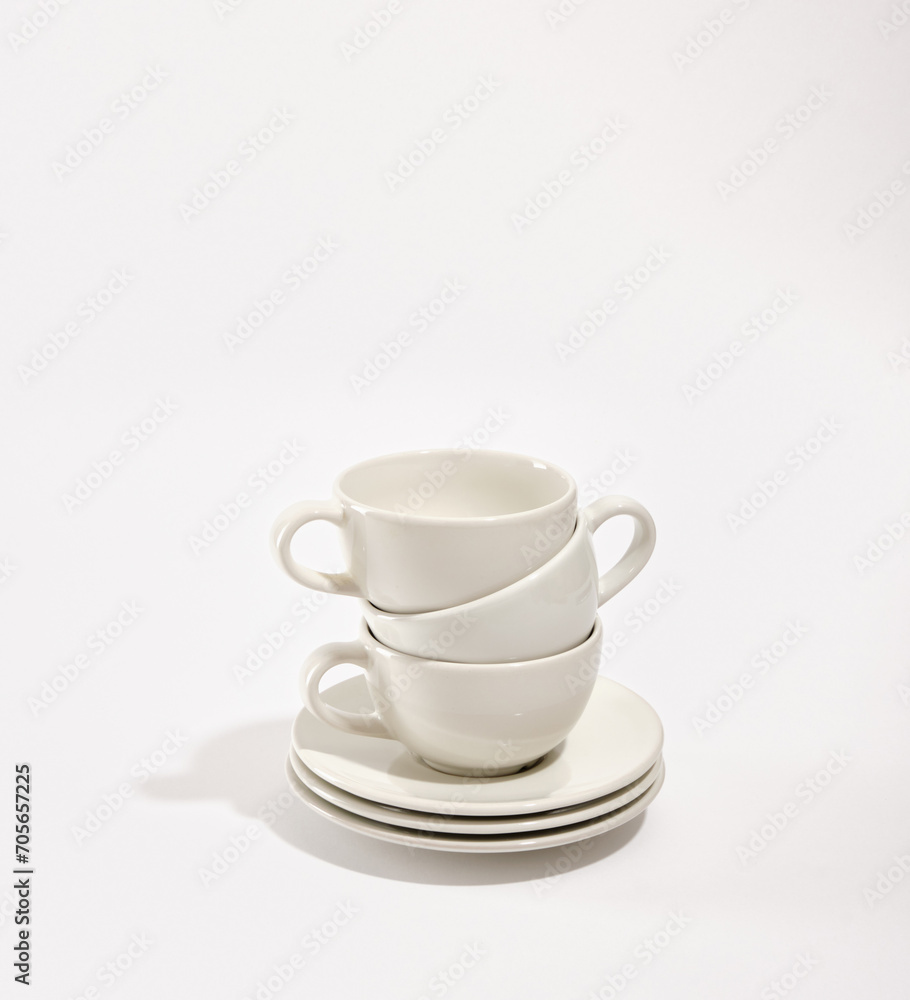 Set of clean luxury white cookware. Clean washed plates and cups.