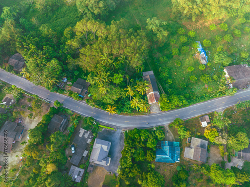 Aerial view rural road tropical rainforest village morning sunrise