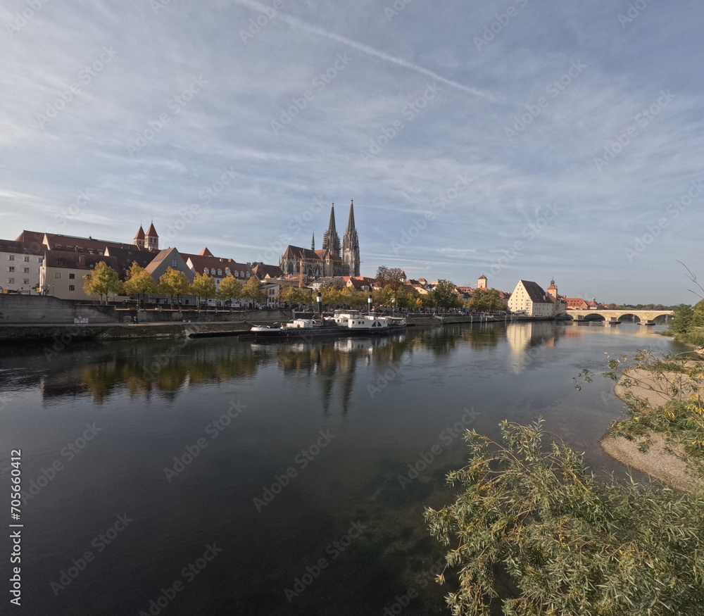 Regensburg on the Danube with stone bridge in sunshine and clouds in autumn