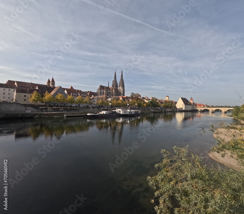 Regensburg on the Danube with stone bridge in sunshine and clouds in autumn