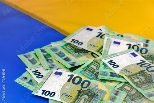 Financial Aid for Ukraine. Finance Assistance, Donation, Investments Euro Money on Ukrainian Flag Background.
