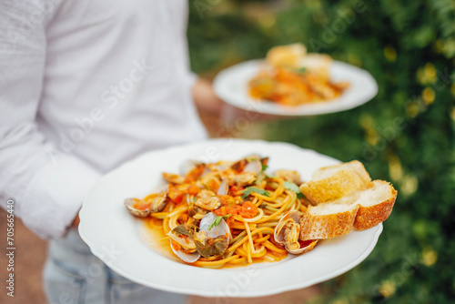 Seafood Spaghetti with seashells, prawns, squids on table background.