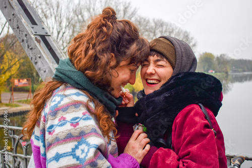 Fotografie Positive female gay couple love enjoying time together