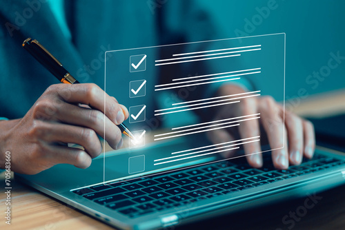 check the form online on the laptop, documents tick the checkmark. concept of checklist process order, audit on the list of documents. business verify task detail and evaluation tick mark photo