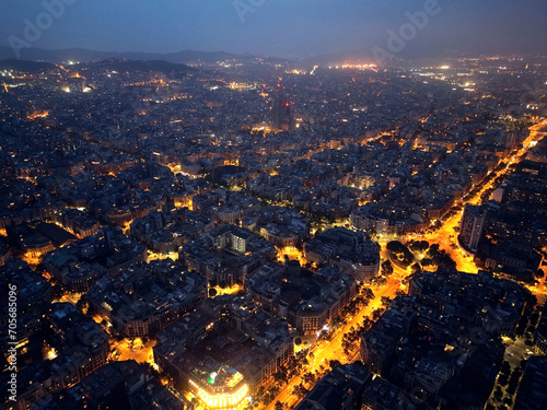 Central areas of Barcelona at night. Top view, filming from a drone.